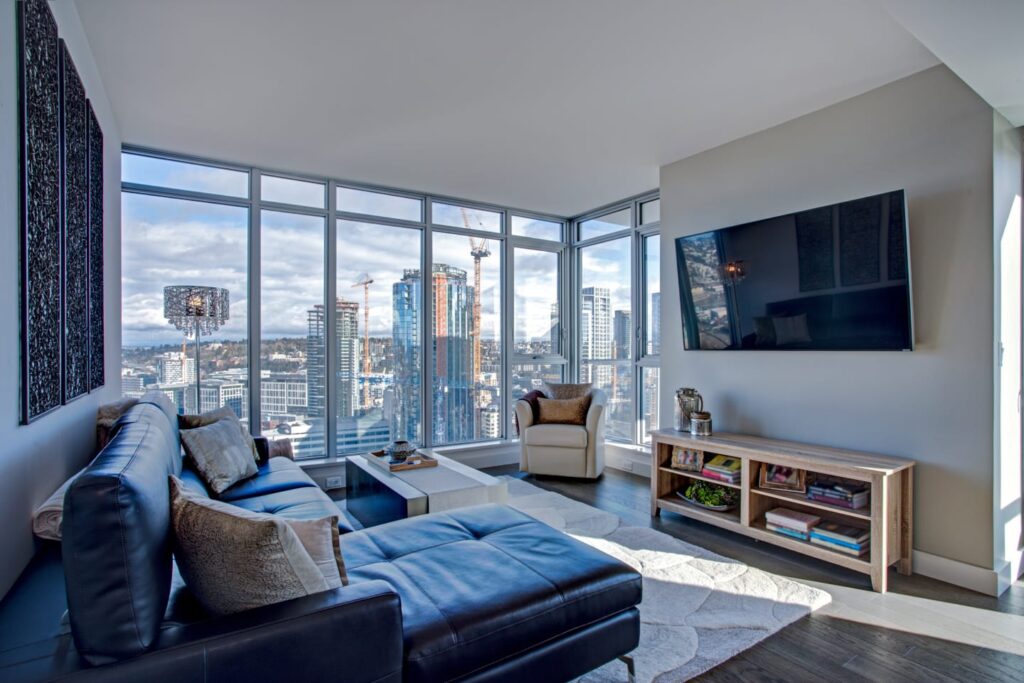 Spacious living room with city view out window