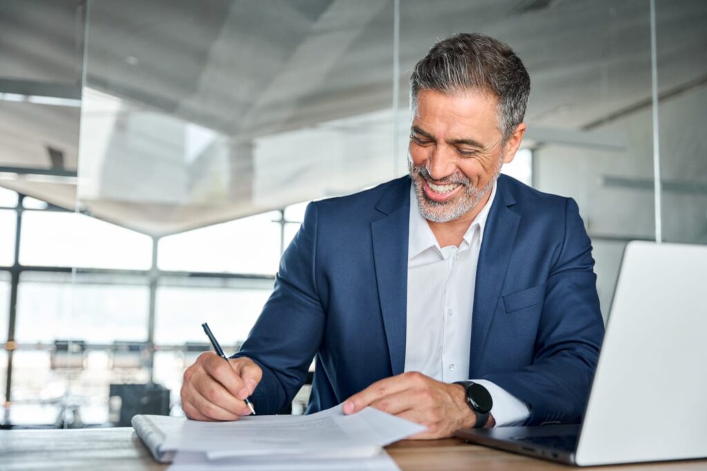 Business person signing a DSCR loan 