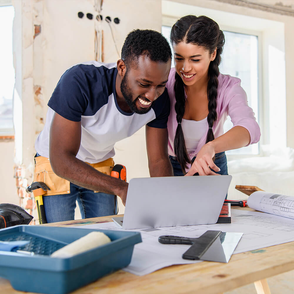Young couple planning home renovations with a Fannie Mae HomeStyle loan