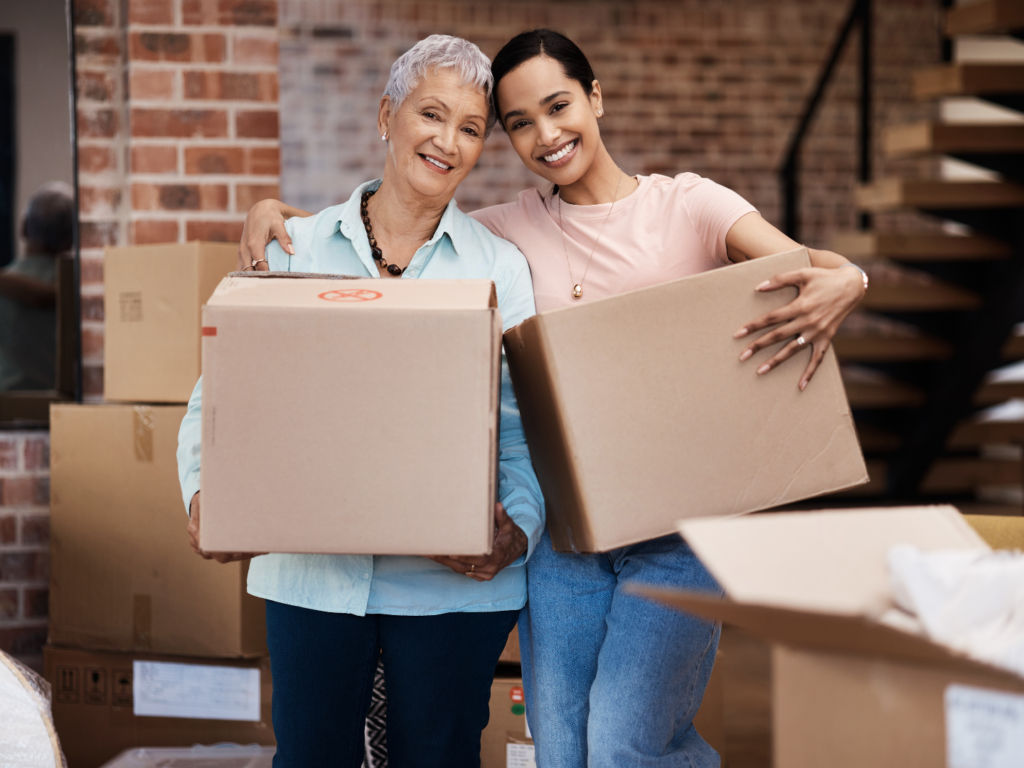 a senior mother and daughter moving after buying a house