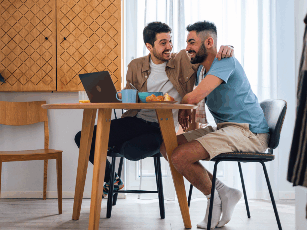 a couple sitting in their kitchen reviewing their home options and reading how much home can you afford