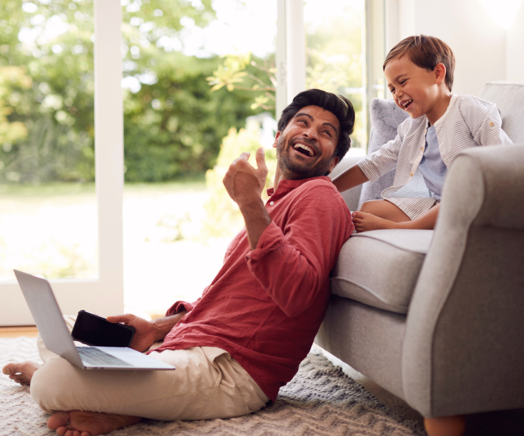a father and child in their home reviewing options for mortgage refinancing when it makes sense