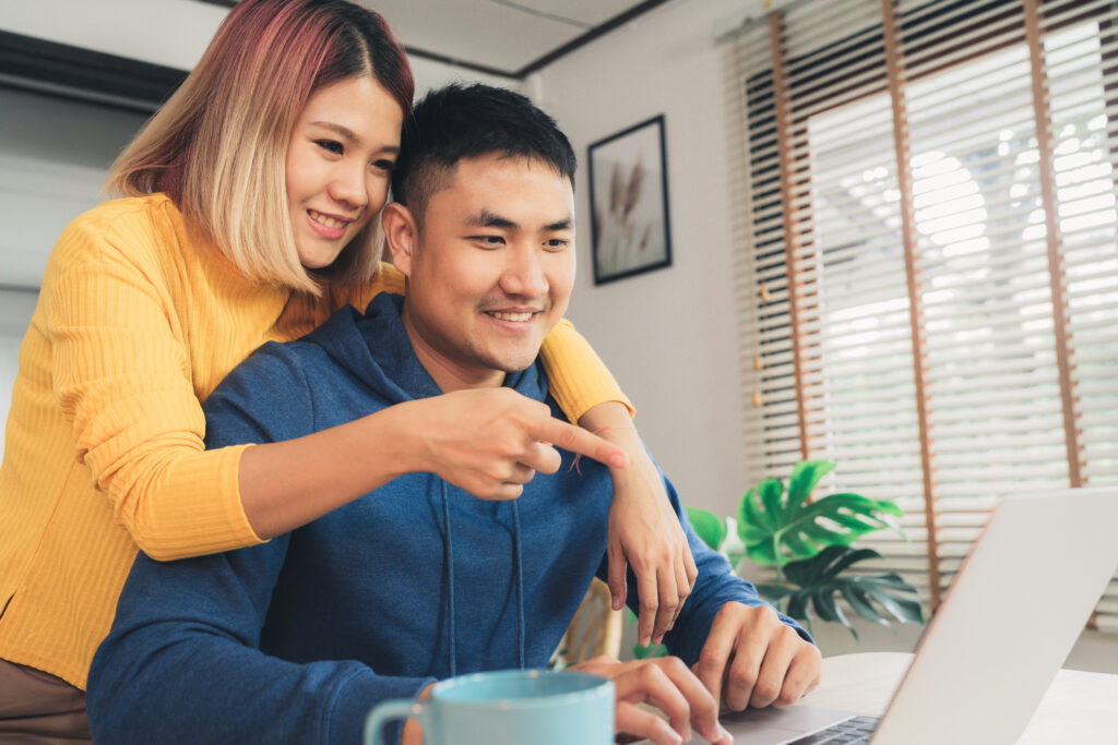 Young couple researching what is a cash-out refinance 